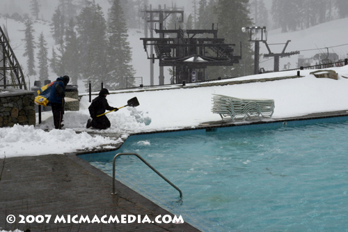 Nugget #112 C shoveling snow into lagoon